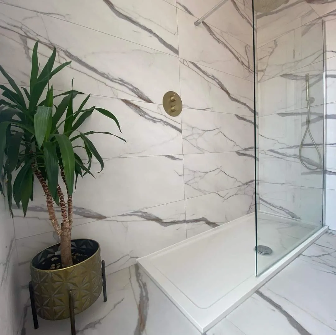 Marble tiled walk in shower fitted in a Preston bathroom
