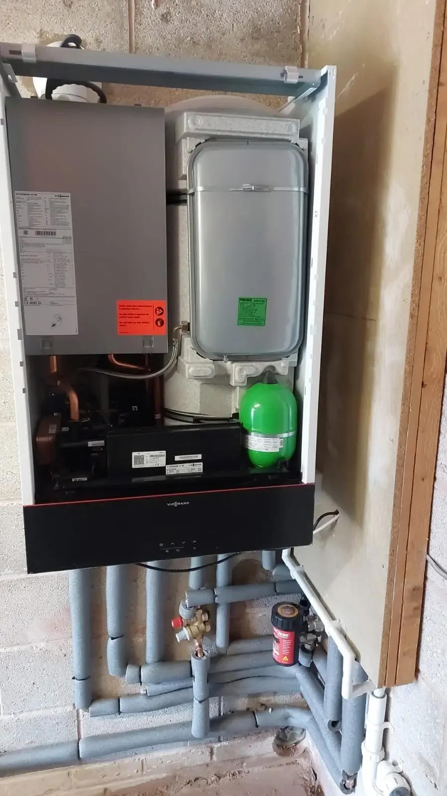 Boiler internals and pipework during a Gas Safe installation in Preston